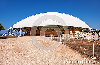 The view of megalithic temple of Hagar Qim under protective ten Editorial Stock Photo