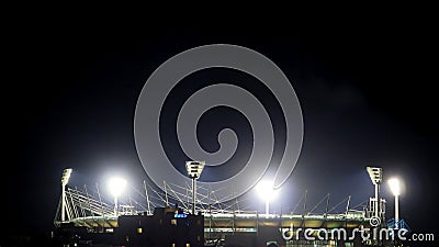 View of Melbourne cricket ground stadium lights during a footy game at night in Melbourne Editorial Stock Photo