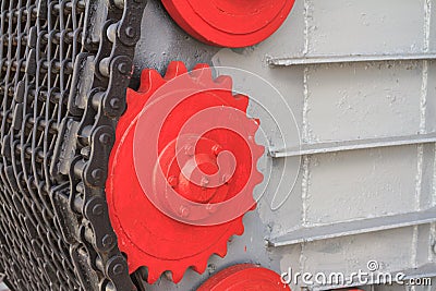 View of the metal chain with cogwheel of the mechanical unit of an old steam locomotive closeup Stock Photo