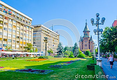 View of the metropolitan cathedral in romanian city timisoara with a statue of romulus, remus and a wolf in front of it Editorial Stock Photo