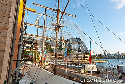 View through mock ships rigging to Hyatt Hotel and Sydney Harbour Bridge Editorial Stock Photo
