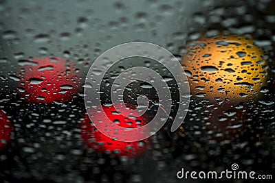View of the modern city through the window on a very dark stormy night. Concept life of a modern city, urban traffic Stock Photo
