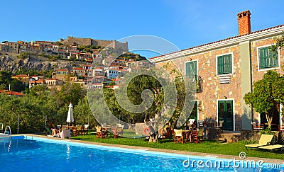 View of Molyvos Village and Castle with hotel pool in foreground. Lesbos Greece. Editorial Stock Photo