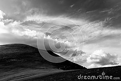 View of Monte Cucco mountain Umbria, Italy with a deep sy with clouds Stock Photo