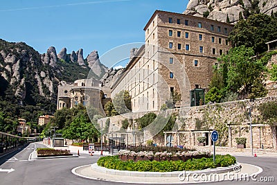 View of Montserrat monastery at noon. Main entrance. Montserrat mountains in the background Editorial Stock Photo