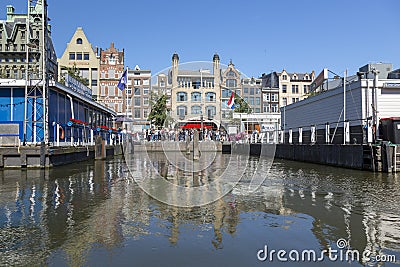 View of the mooring of pleasure boats on Damrak Street in Amsterdam Editorial Stock Photo