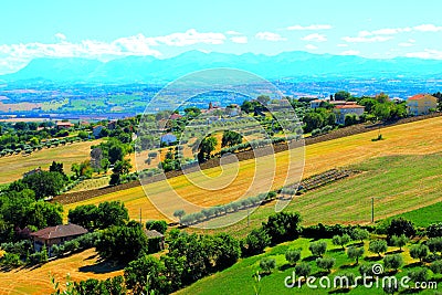 View from Morrovalle at a Marche hilly landscape with fields, trees and houses Stock Photo