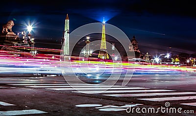 View on motion blur on background of the Luxor Obelisk and Eiffel Tower in the night Editorial Stock Photo