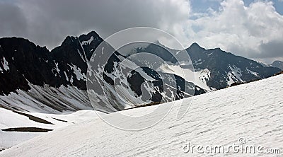 View of Mountain Range in Swiss Alps in Summer Stock Photo