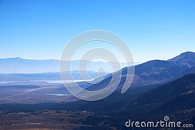 View of mountains in a foggy morning against a blue sky Stock Photo