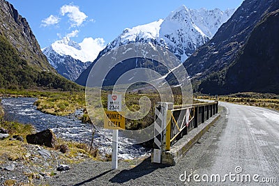 View of bridge and mountains from Monkey Creek, Fjordland, South Island, New Zealand. State Highway 94. Stock Photo