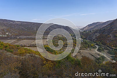 View of the mountains, river, fields and valley from the hill Stock Photo