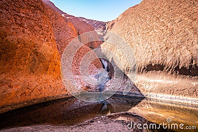 View of the Mutitjulu waterhole on summer time with clear sky in NT outback Australia Stock Photo