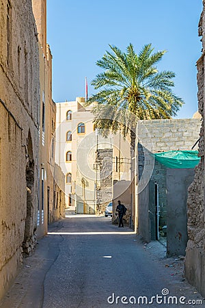 View of a narrow street of the old town of Nizwa, Oman....IMAGE Editorial Stock Photo