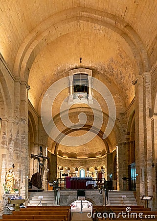 view of the nave with choir and apse of the Church of the Saintes Maries de la Mer Editorial Stock Photo