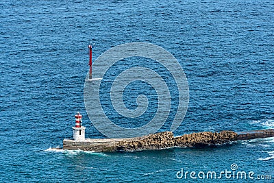 View on a navigational light at the harbor entrance Stock Photo