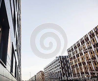 view on new modern buildings, facade corner and sky, real parkings on line Stock Photo