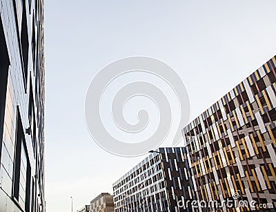 view on new modern buildings, facade corner and sky, real parkings on line Stock Photo