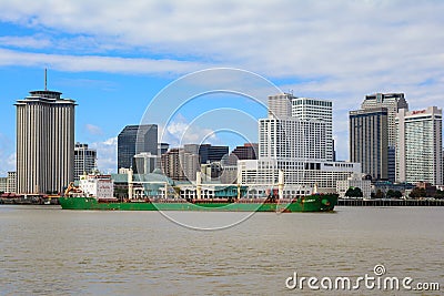 View of New Orleans downtown with cargo ship in the Mississippi river. Editorial Stock Photo