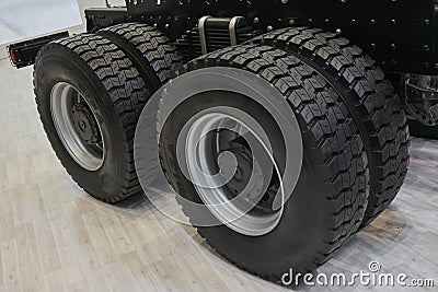 View on new truck wheels and tires on truck chassis. Truck wheel rim. Truck chassis parts details devices equipment. New wheels an Stock Photo