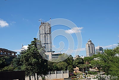 A view of the newest high-rise skyscraper building on the skyline of Sandton , the economic and financial hub of the city of Joha Editorial Stock Photo