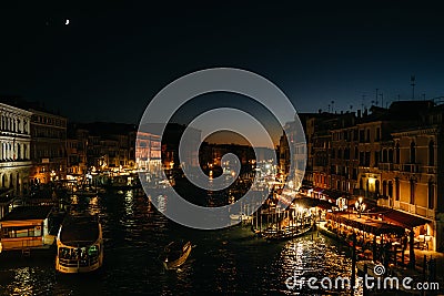 View of the night of Venice. Boats on the water. Moonlight Editorial Stock Photo