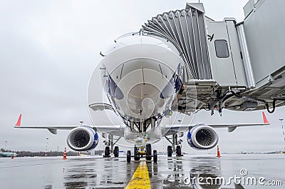 View of the nose and cockpit of the aircraft directly standing on the airport apron Stock Photo