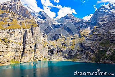 View of Oeschinen lake (Oeschinensee) and Swiss Alps near Kandersteg in Bernese Oberland, Switzerland Stock Photo