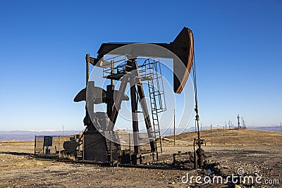 View of Oil Well Pumpjack at Daylight Oil Industry Stock Photo