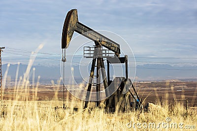View of Oil Well Pumpjack at Daylight Oil Industry Stock Photo