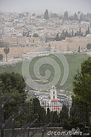 View of the old city of Jerusalem, Israel. Greek church, trees, stone wall Stock Photo