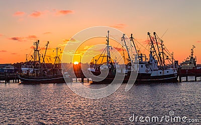 Beautiful, panoramic view on old fishing trawler on the Harbour of Romo RÃ¸mÃ¸ Havn during sunset. In the Background old ships, Editorial Stock Photo