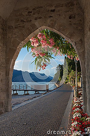 View through old gate to mediterranean landscape Stock Photo