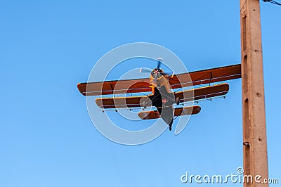 View on an old plane flying againtst the blue sky Stock Photo