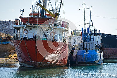 Old, rusty, cargo vessels at a ship-breaker. Stock Photo