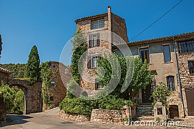 View of old stone houses in alley under blue sky at Les Arcs-sur-Argens Stock Photo