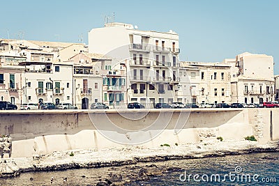 View of old street, facades of ancient buildings in seafront of Ortygia Ortigia Island, Syracuse, Sicily, Italy Editorial Stock Photo