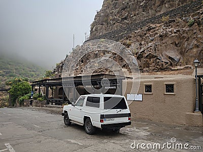 An old white Toyota Hiace van parked outdoors Editorial Stock Photo