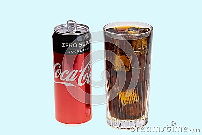 View of open coca can and soda with ice in crystal glass. Drink concept. Editorial Stock Photo