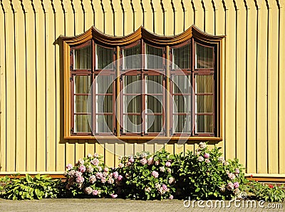 Ornamented rustic window Stock Photo