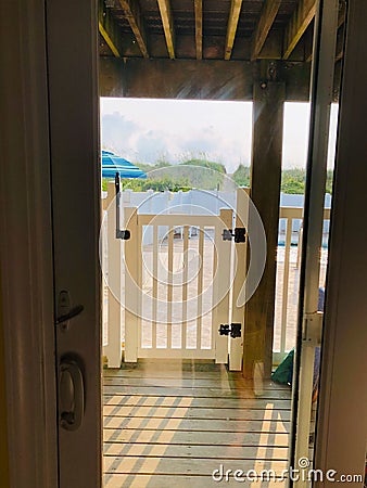 View from our bedroom to the beach, just beyond the green.. Stock Photo