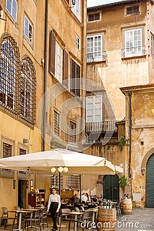 View of outdoor cafe in a small plaza Editorial Stock Photo