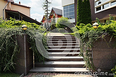 View of outdoor stairs and green plants in residential area Stock Photo