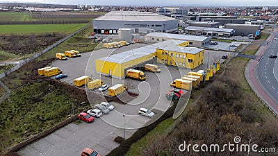 View over the DHL delivery warehouse of Weiterstadt with DB Schenker logistics hall and Seat Germany Editorial Stock Photo
