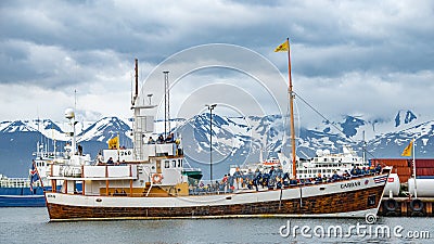 View over harbor in Husavik, a northern capital for whale watching safari in Iceland Editorial Stock Photo