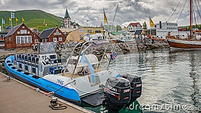 View over harbor in Husavik, a northern capital for whale watching safari in Iceland Editorial Stock Photo