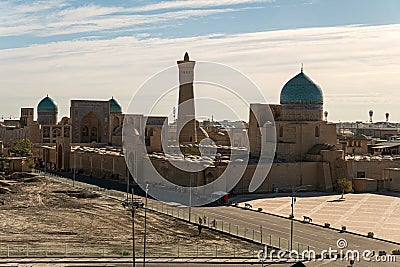 View over the Poi Kalon Mosque and Minaret from Ark fortress, in Bukhara, Uzbekistan. Blue sky Stock Photo