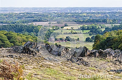 A view over Precambrian rock outcrops towards the city of Leicester in Bradgate Park, Leicestershire, UK Stock Photo