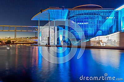 View over river Spree in Berlin to illuminated Paul-LÃ¶be building in the government quarter in evening twillight Editorial Stock Photo