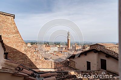 View over the roofs of Siena towards the Torre Magna, seen from the roof of the Siena cathedral Stock Photo